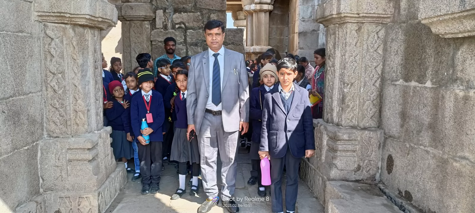 Students with a teacher during a school heritage visit