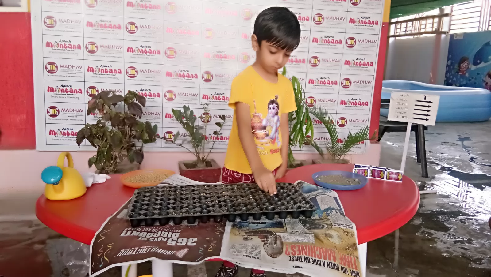 A young student participating in a hands-on planting activity